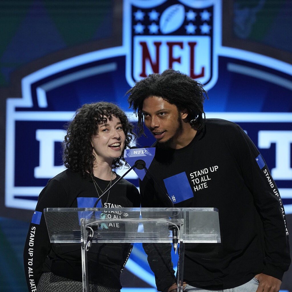 Christian Harvey and Emma Fries wearing Stand Up To All hate shirts in support of the fight against hate.