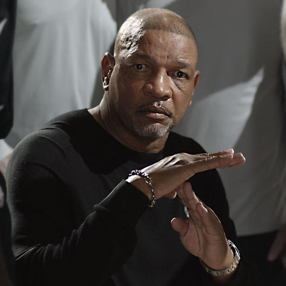 Doc Rivers making the timeout gesture in support of the fight against hate.